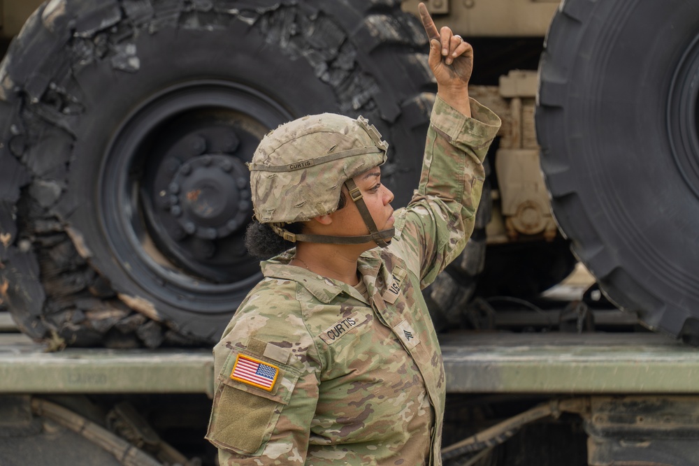13th Armored Corps Sustainment Command Soldiers offload display truck