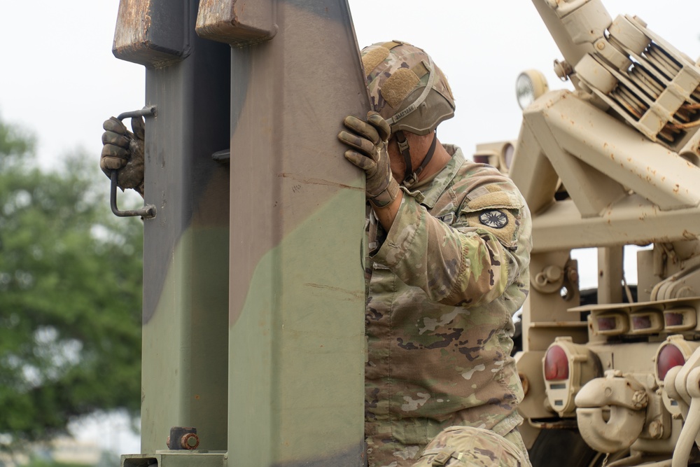 13th Armored Corps Sustainment Command Soldiers offload display truck