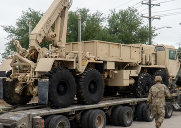 13th Armored Corps Sustainment Command Soldiers offload display truck