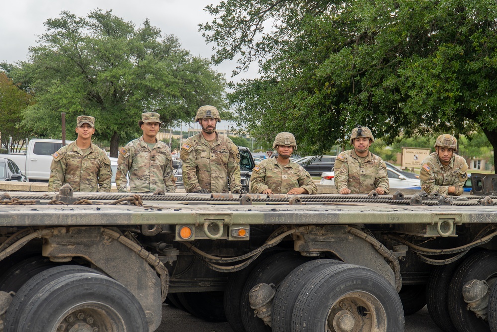 13th Armored Corps Sustainment Command Soldiers offload display truck