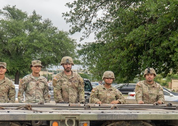 13th Armored Corps Sustainment Command Soldiers offload display truck