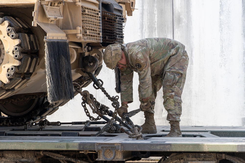 Soldiers from the 13th Armored Corps Sustainment Command prepare military vehicles for display at Texas A&amp;M University
