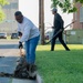 Team members with Operational Medical Systems participate in spring clean-up