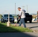 Team members with Operational Medical Systems participate in spring clean-up