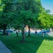 Team members with Operational Medical Systems participate in spring clean-up