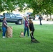 Team members with Operational Medical Systems participate in spring clean-up