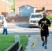 Team members with Operational Medical Systems participate in spring clean-up
