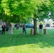Team members with Operational Medical Systems participate in spring clean-up