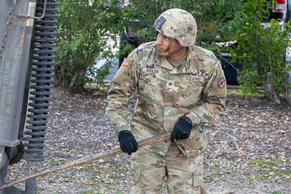 Soldiers from the 13th Armored Corps Sustainment Command prepare military vehicles for display at Texas A&amp;M University