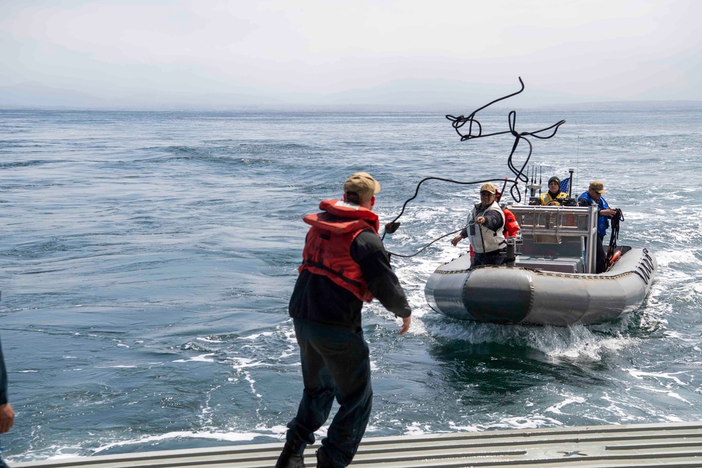 USS John P Murtha transfers personnel via a rigid hull inflatable boat