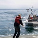 USS John P Murtha transfers personnel via a rigid hull inflatable boat