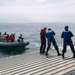 USS John P Murtha transfers personnel via a rigid hull inflatable boat