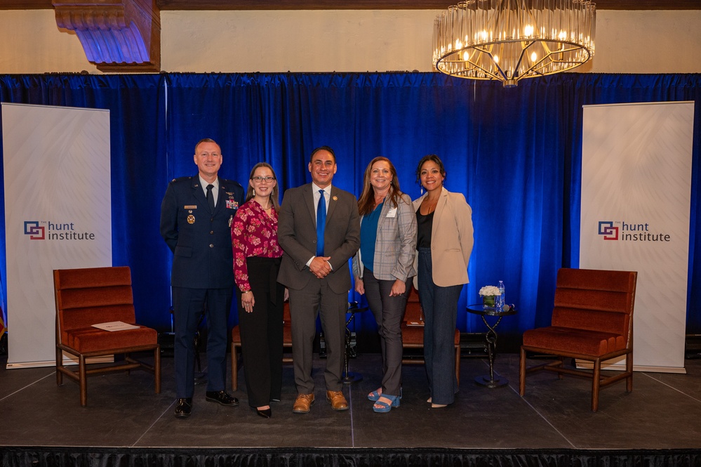 Panelists from the Education Support for Military Families discussion pose for a group photo with U.S. Air Force Col. Dvid Wyrick
