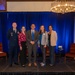 Panelists from the Education Support for Military Families discussion pose for a group photo with U.S. Air Force Col. Dvid Wyrick