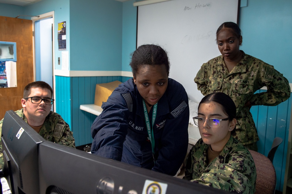 USS John C. Stennis (CVN 74) Sailors input information during school of ship