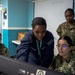 USS John C. Stennis (CVN 74) Sailors input information during school of ship
