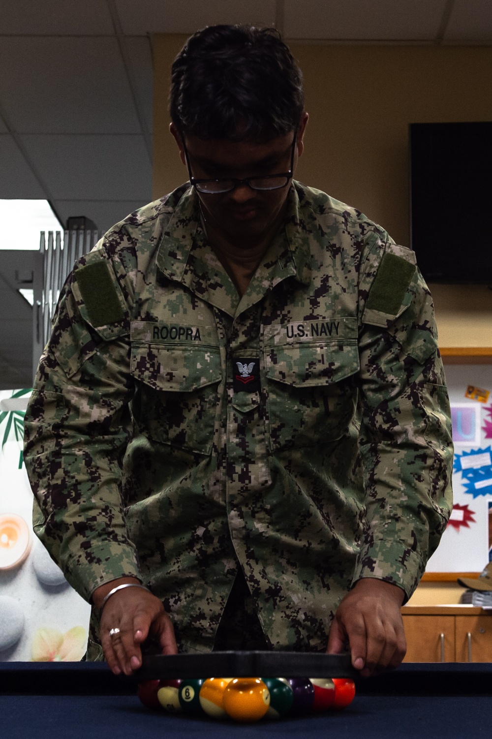 USS John C. Stennis Sailor racks pool balls