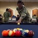 USS John C. Stennis Sailor plays pool