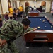 USS John C. Stennis Sailor plays pool