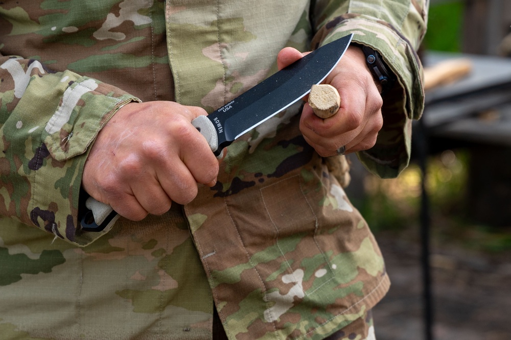Former SERE specialist Tom Lutyens teaches bow drill