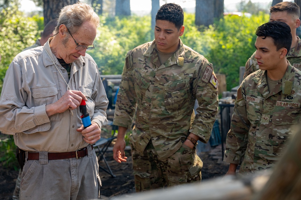 Former SERE specialist Tom Lutyens teaches bow drill