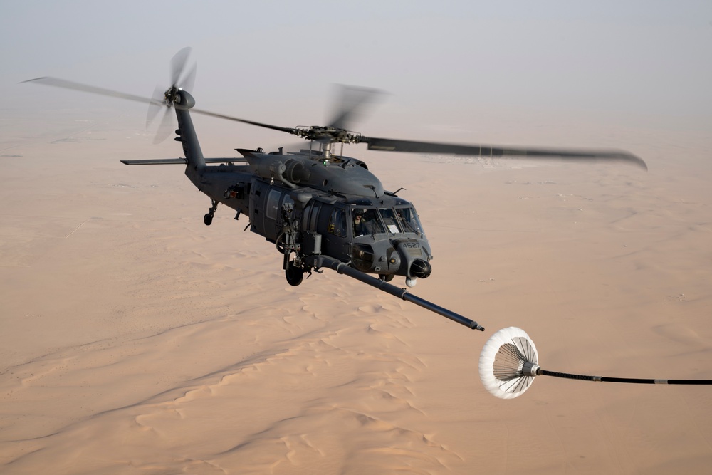 Air Force Jolly Green IIs refuel over USCENTCOM AOR