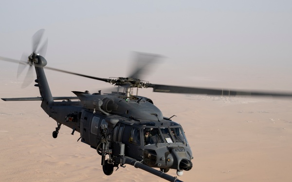 Air Force Jolly Green IIs refuel over USCENTCOM AOR