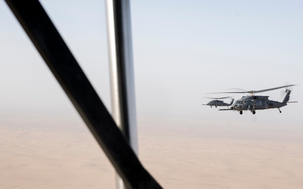 Air Force Jolly Green IIs refuel over USCENTCOM AOR