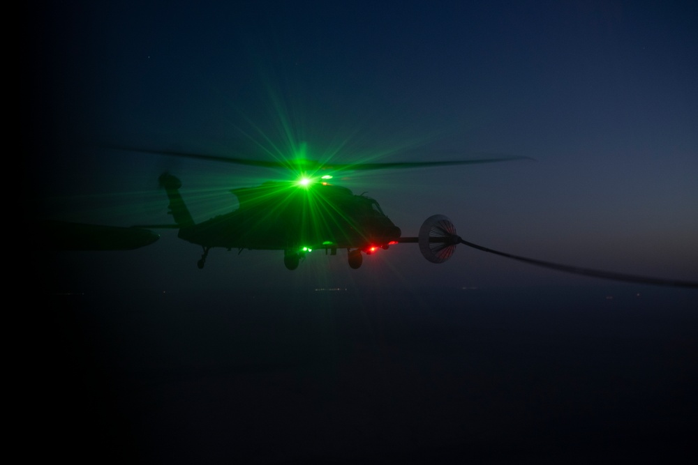 Air Force Jolly Green IIs refuel over USCENTCOM AOR