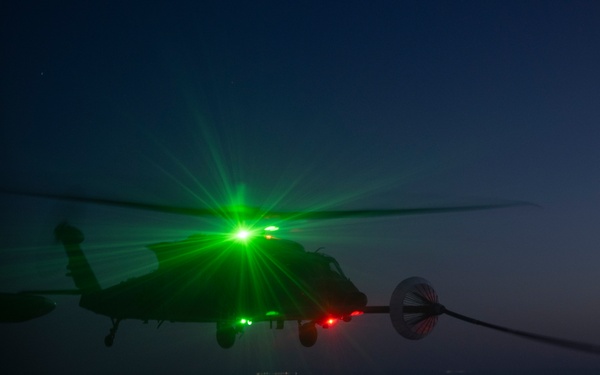 Air Force Jolly Green IIs refuel over USCENTCOM AOR