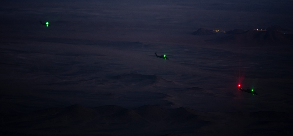 Air Force Jolly Green IIs refuel over USCENTCOM AOR
