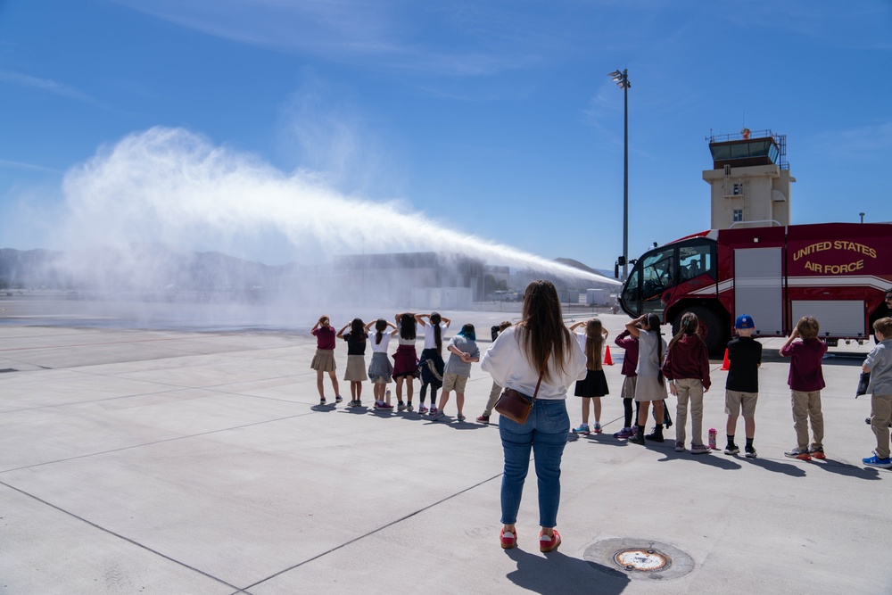 It's Getting Hot: Fire Fighters spray water from the fire truck during a base tour at the Nevada Air National Guard Base May 9, 2025