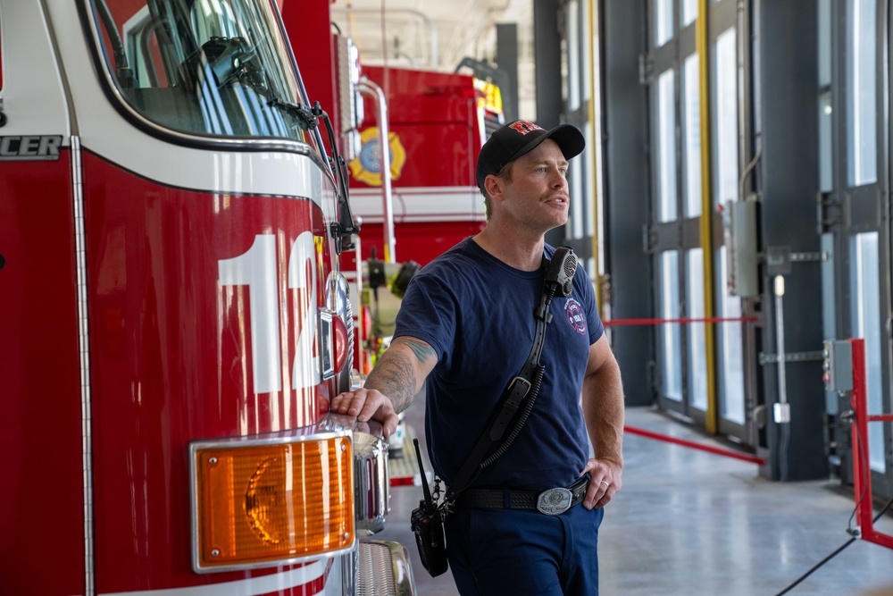 State Fire Fighter Jessee Selby, assigned to the 152nd Civil Engineer Squadron's Fire Department, speaks to children about his job during a base tour at the Nevada Air National Guard Base on May 9, 2025.