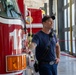 State Fire Fighter Jessee Selby, assigned to the 152nd Civil Engineer Squadron's Fire Department, speaks to children about his job during a base tour at the Nevada Air National Guard Base on May 9, 2025.