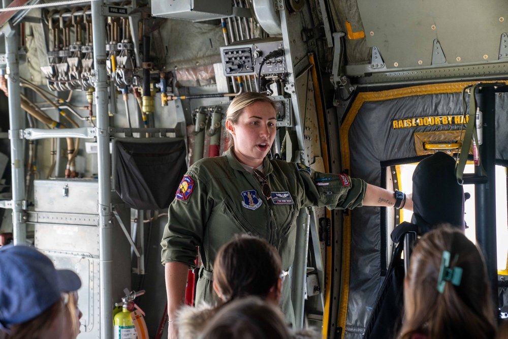 Tech. Sgt. Sydney Goddard, a loadmaster assigned to the 152nd Operations Group, talks to children about her job during a base tour at the Nevada Air National Guard Base on May 9, 2025