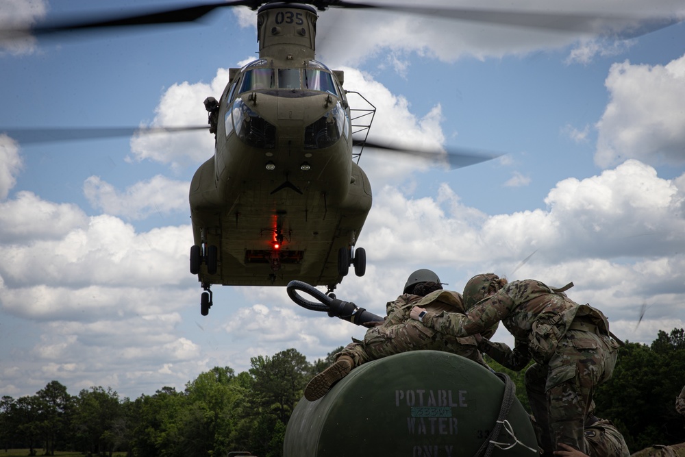 117th Field Artillery and the 169th Aviation train in sling load operations together