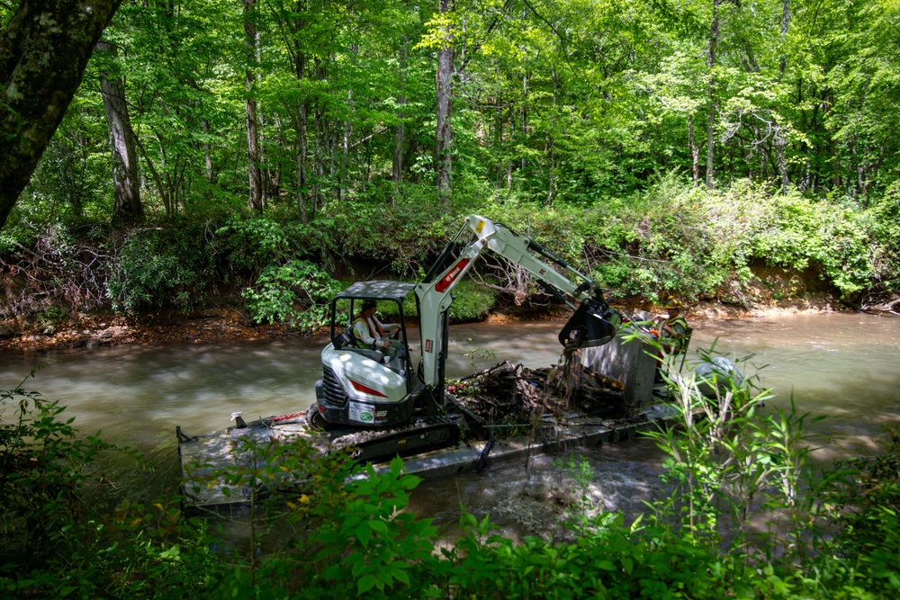 Barges remove hurricane Helene debris at in Macon County