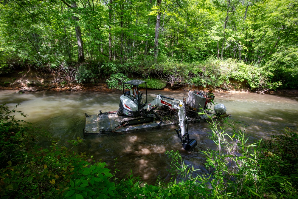 Barges remove hurricane Helene debris at in Macon County