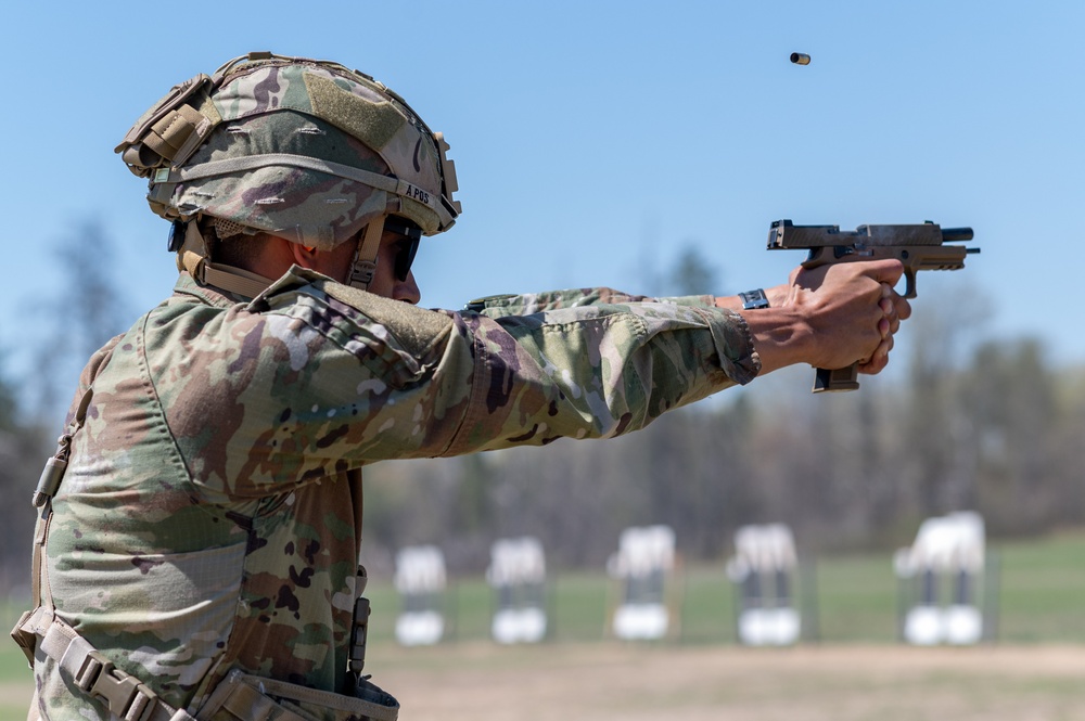 Capt. Kevin Tirado Army Reserve Medical Command, fires an M17 pistol