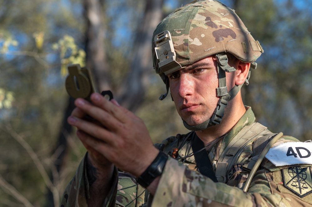 Pfc. Luke Griguolo checks his compass
