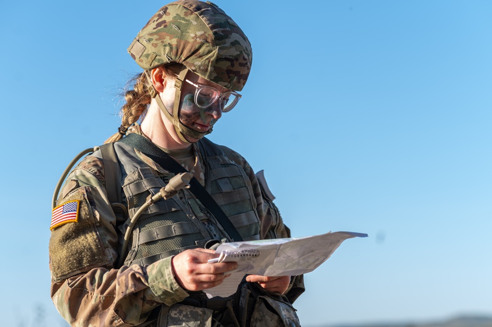 Staff Sgt. Emily Newsome looks at her map