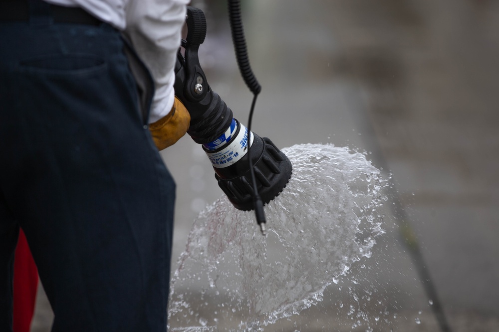 This is fire: U.S. Navy Sailors practice extinguishing fires.