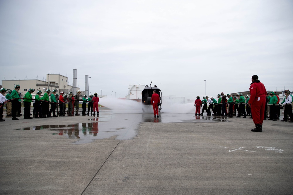This is fire: U.S. Navy Sailors practice extinguishing fires.