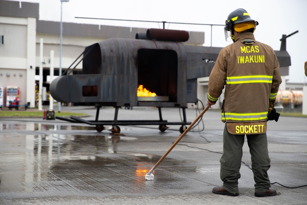 This is fire: U.S. Navy Sailors practice extinguishing fires.