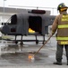 This is fire: U.S. Navy Sailors practice extinguishing fires.