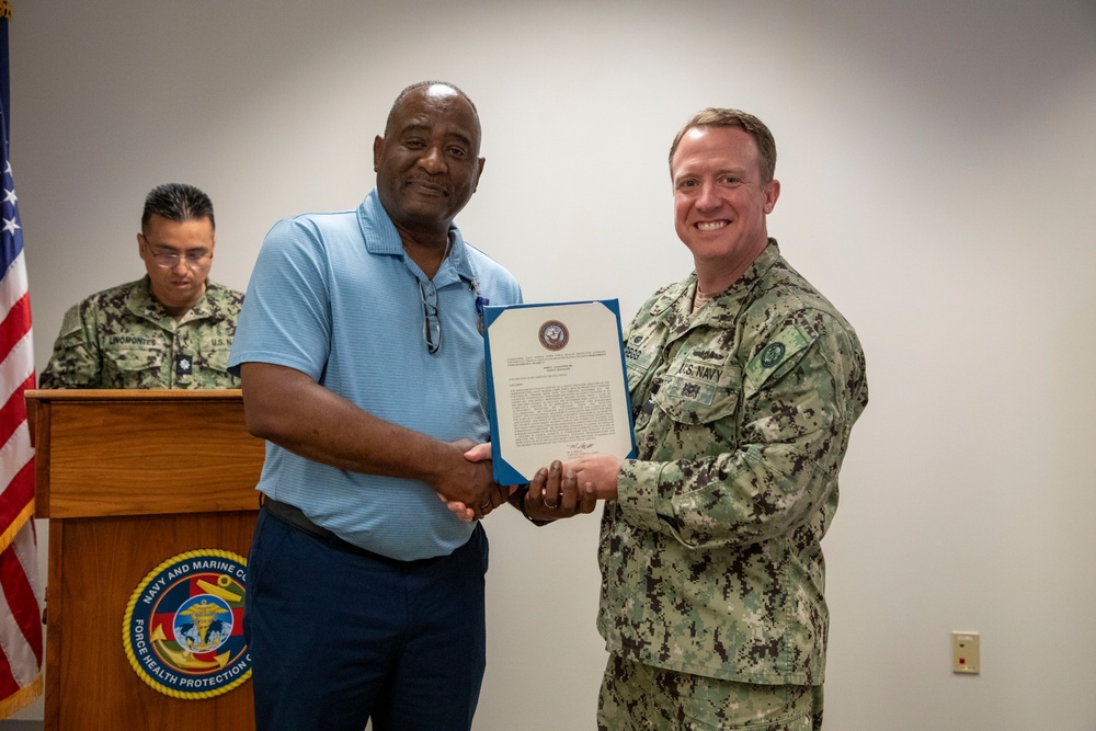 Navy and Marine Corps Force Health Protection Command (NMCFHPC) hosts an award ceremony for Hospital Corpsman First Class Jacqueline Holman and a retirement ceremony for Mr. John Valentine and Mr. Gregory Stone