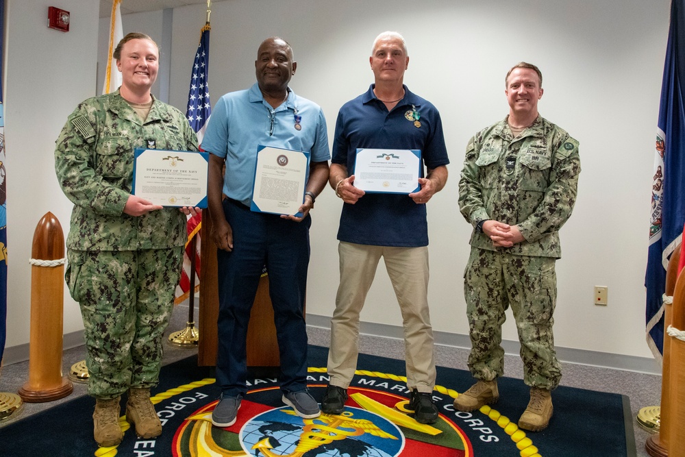 Navy and Marine Corps Force Health Protection Command (NMCFHPC) hosts an award ceremony for Hospital Corpsman First Class Jacqueline Holman and a retirement ceremony for Mr. John Valentine and Mr. Gregory Stone