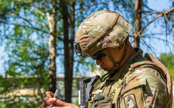 V Corps Soldiers conduct land navigation during best squad competition