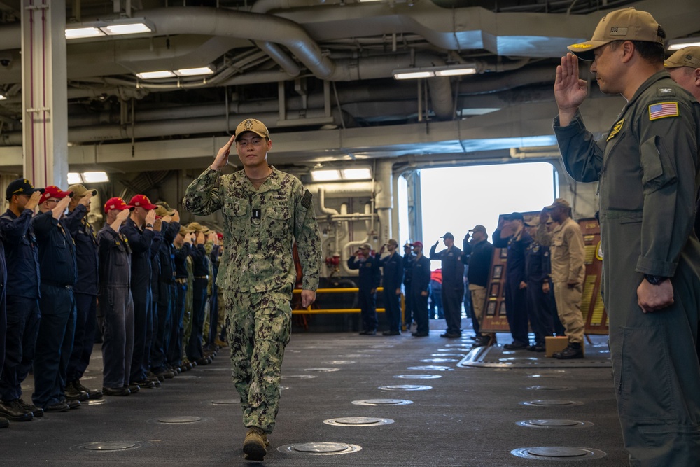 USS Tripoli Sailor Lt. j.g Kingmin Lee is Piped Ashore
