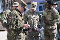 Swift Response 25: Latvian National Armed Forces show Sky Soldiers How To Operate Target Lifters [Image 1 of 3]